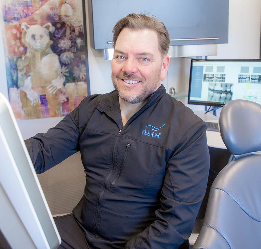 A member of the Alber Dental Studio team preparing for a cosmetic dentistry appointment in Boulder, CO