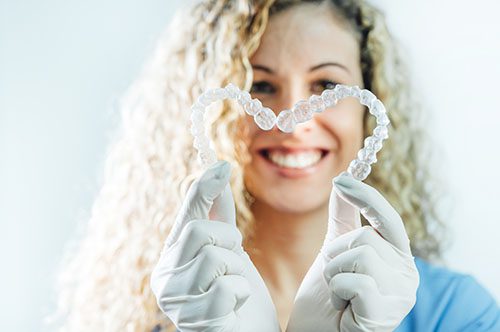 Straighten Up With Invisalign for National Align Your Teeth Day